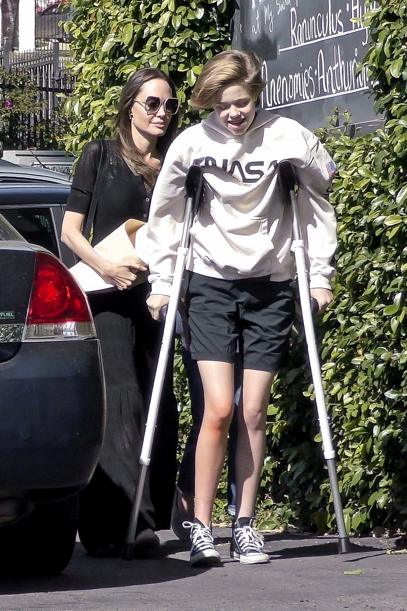 Los Feliz, CA  - *EXCLUSIVE* **WEB MUST CALL FOR PRICING**  - Actress Angelina Jolie looks classy in a maxi black dress while out buying flowers with her kids Shiloh and Vivienne. Shiloh can be seen walking with the help of crutches.

*UK Clients - Pictures Containing Children
Please Pixelate Face Prior To Publication*, Image: 504853744, License: Rights-managed, Restrictions: , Model Release: no, Credit line: Bruce/Javiles/WCP / BACKGRID / Backgrid USA / Profimedia